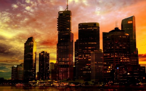 Image city skyline under cloudy sky during night time