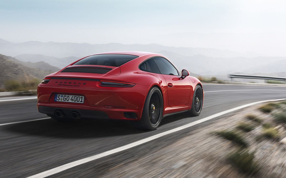 red porsche 911 on road during daytime