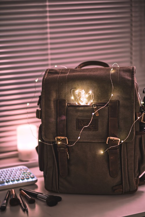 Image black leather handbag on table