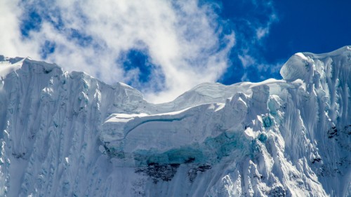 Image white ice mountain under blue sky during daytime