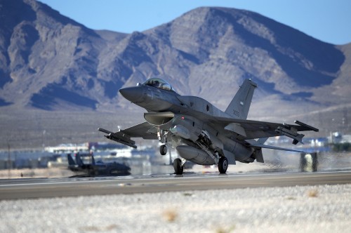 Image gray fighter jet on gray concrete road during daytime