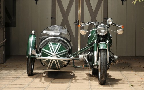 Image green and black motorcycle in a room