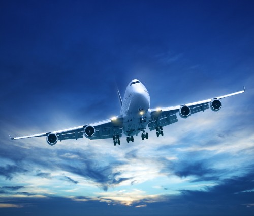 Image white and blue airplane under blue sky during daytime