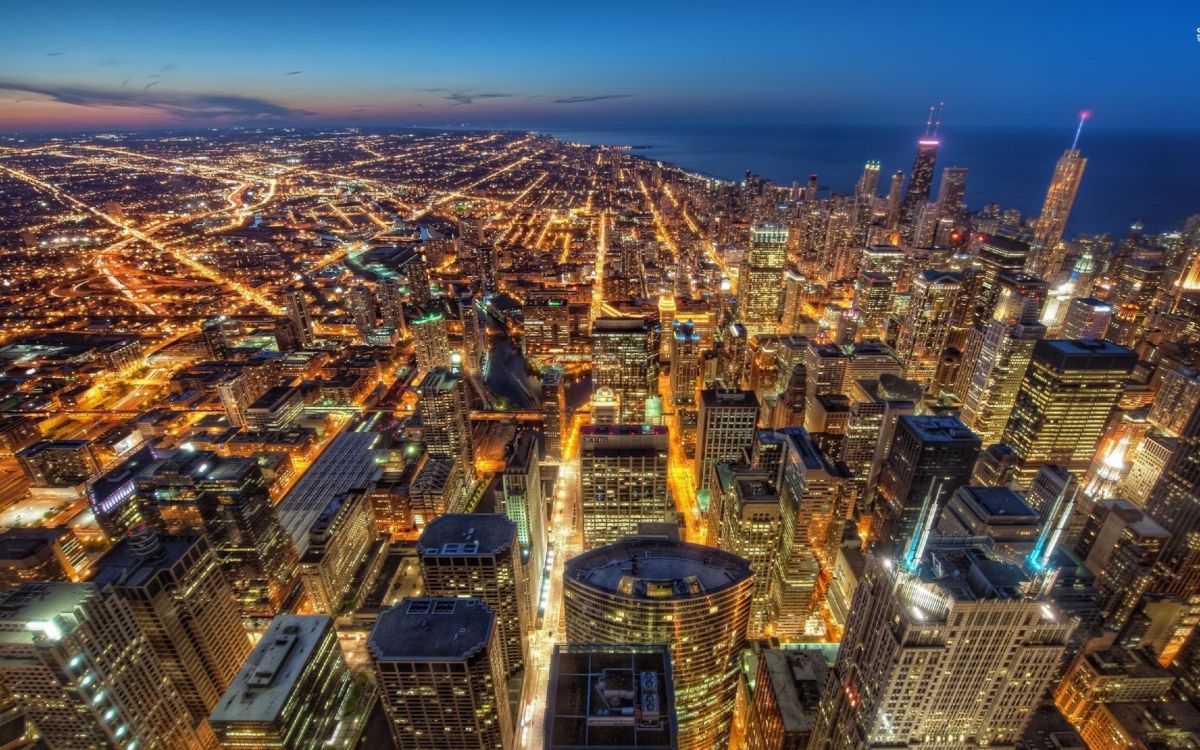 Vista Aérea de Los Edificios de la Ciudad Durante la Noche.. Wallpaper in 2560x1600 Resolution