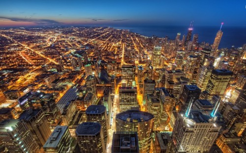 Image aerial view of city buildings during night time