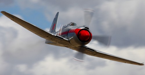 Image white and red airplane under white clouds during daytime