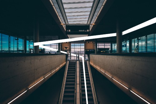 Image gray and black escalator inside building