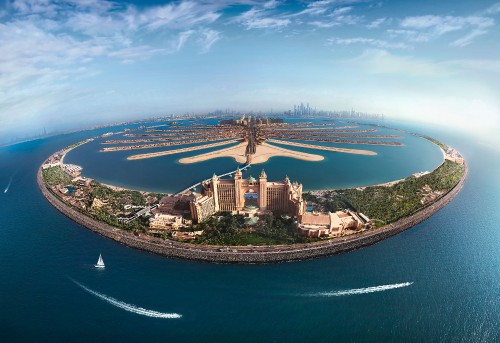 Image aerial view of city buildings near body of water during daytime