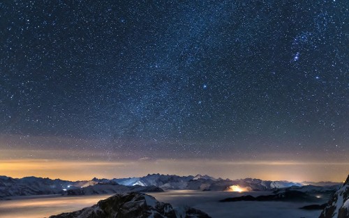 Image snow covered mountain under starry night