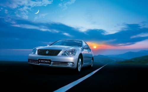 Image white audi a 4 sedan on road during sunset