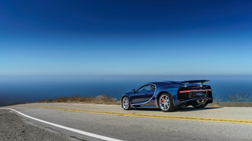 Image black coupe on gray asphalt road during daytime