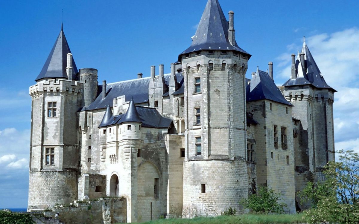 grey concrete castle under blue sky during daytime