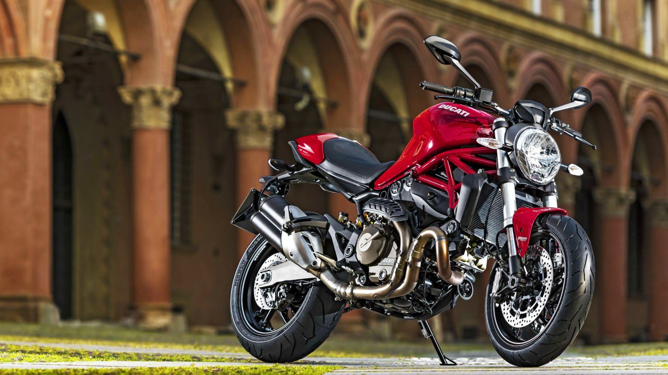 red and black sports bike