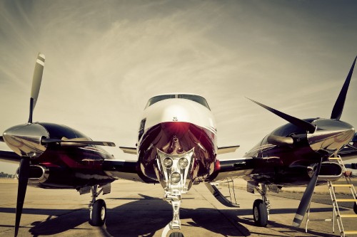 Image red and white airplane on the ground