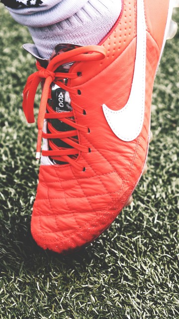 Image red and white nike athletic shoes