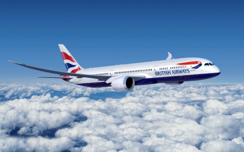 Image white and red air plane flying under blue sky during daytime