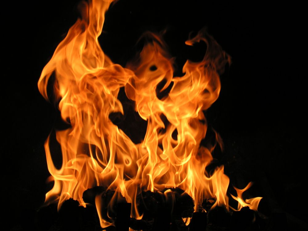 fire in black background with black background