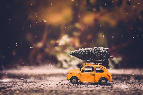 Image yellow car on snow covered ground during daytime