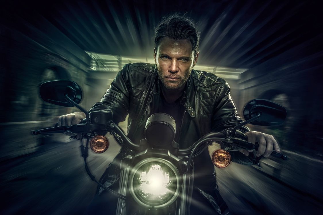 Man in Black Leather Jacket Riding Motorcycle. Wallpaper in 2500x1667 Resolution