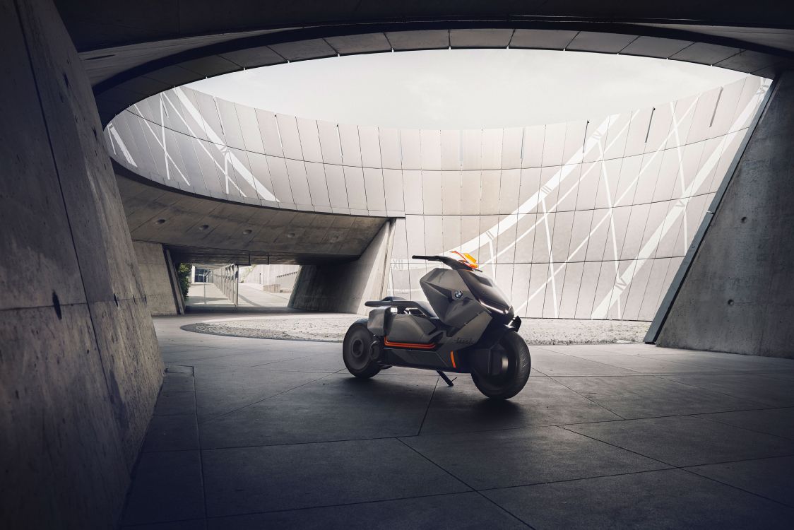 black and orange stroller on gray concrete floor