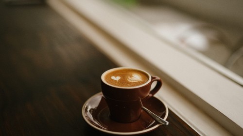 Image brown ceramic mug on saucer