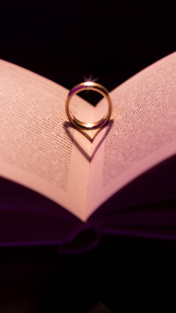 Image silver ring on white book page