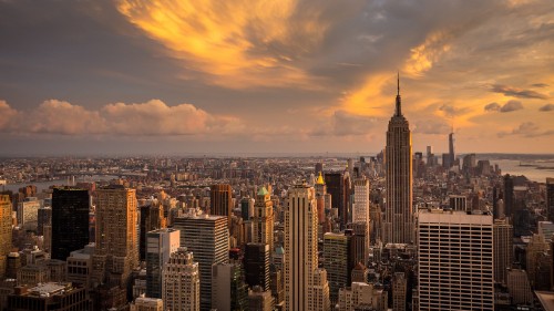 Image city skyline under cloudy sky during sunset