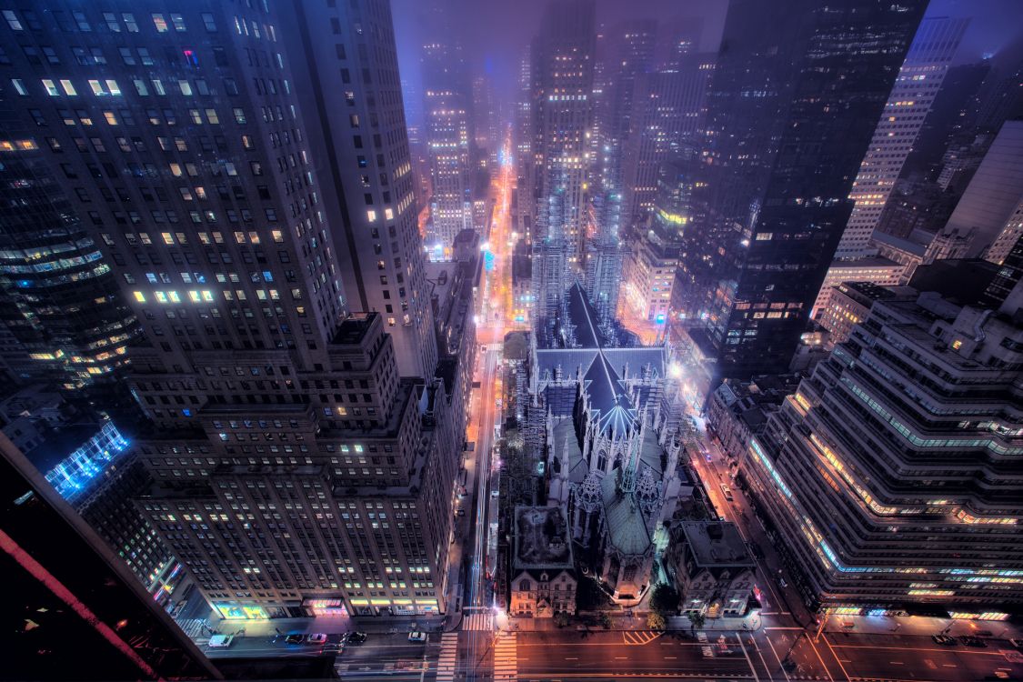 cars on road in city during night time