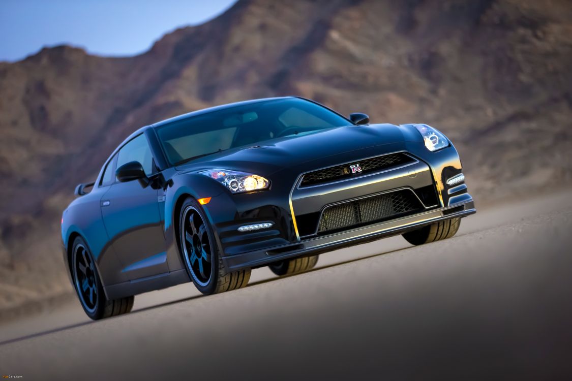 black chevrolet camaro on road during daytime