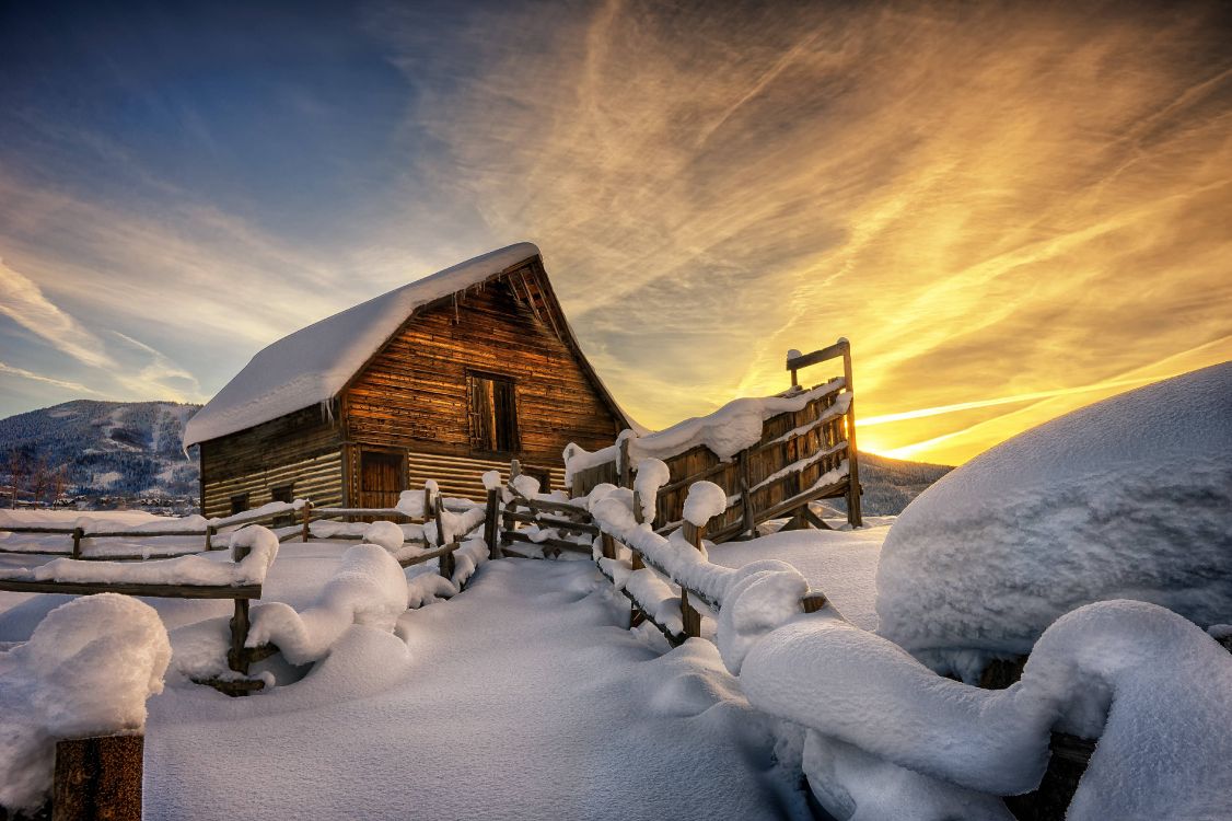 Brown Wooden House Covered by Snow Under Cloudy Sky. Wallpaper in 5996x3991 Resolution