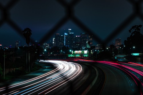 Image time lapse photography of cars on road during night time