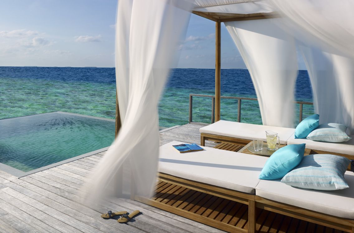 white and blue boat on sea during daytime