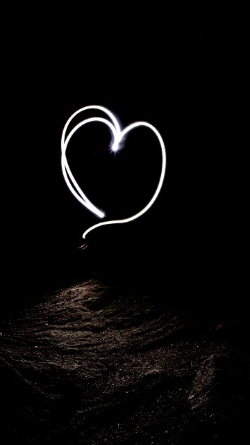 Image white heart shape on black background