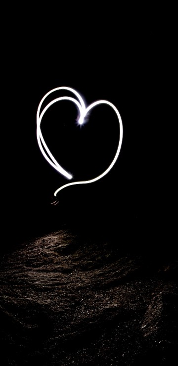 Image white heart shape on black background