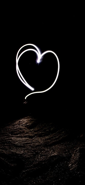 Image white heart shape on black background