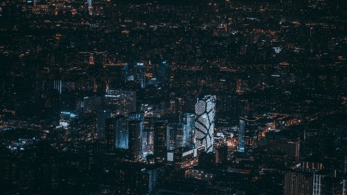 Image aerial view of city buildings during night time