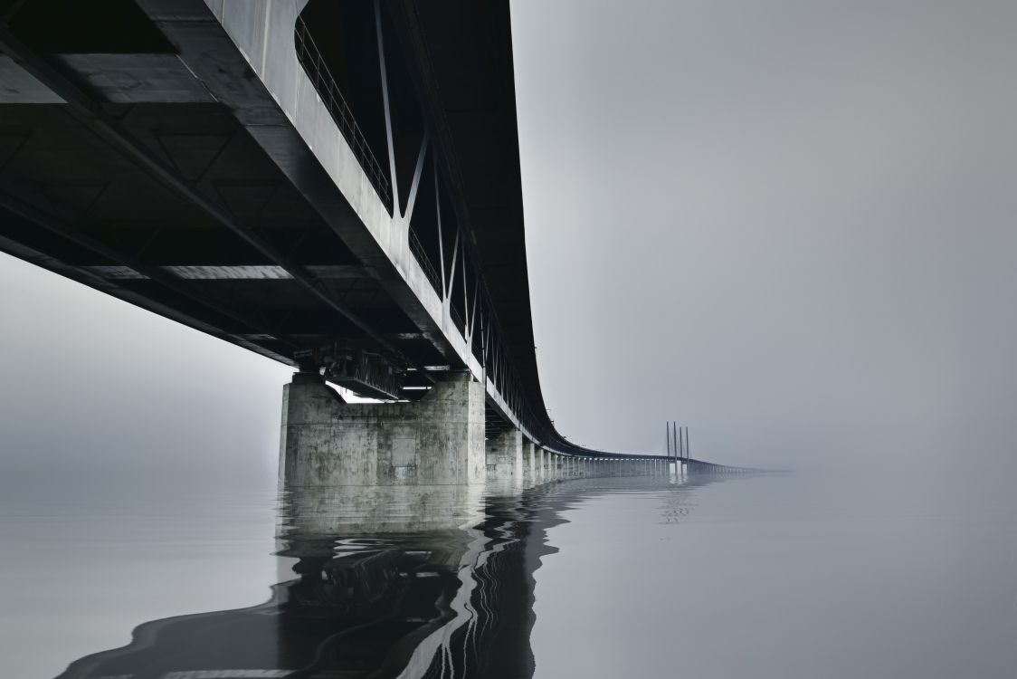 grayscale photo of bridge over water