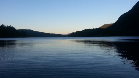 Image body of water near mountain during daytime