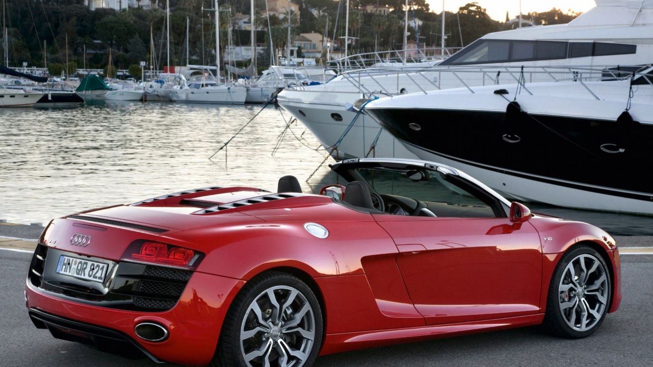 red ferrari 458 italia parked on dock during daytime