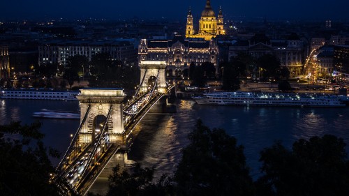 Image lighted bridge over river during night time