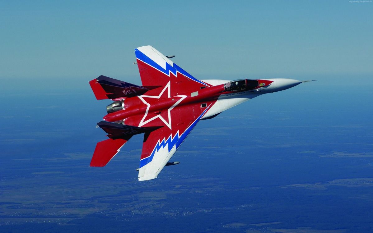 Red and White Jet Plane Flying Over Blue Sky During Daytime. Wallpaper in 3700x2313 Resolution