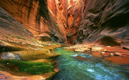 Image brown rocky mountain beside river during daytime