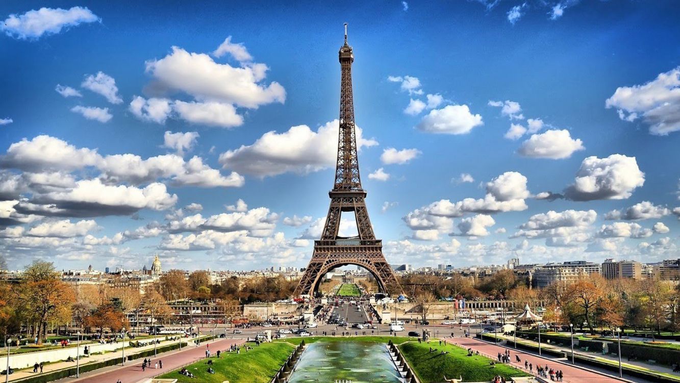 eiffel tower under blue sky and white clouds during daytime