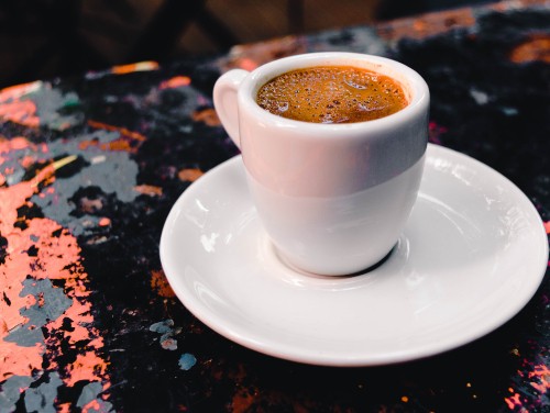 Image white ceramic cup on white ceramic saucer