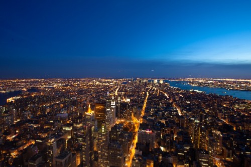 Image aerial view of city buildings during night time