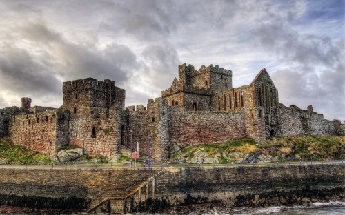 Image brown concrete castle under cloudy sky during daytime