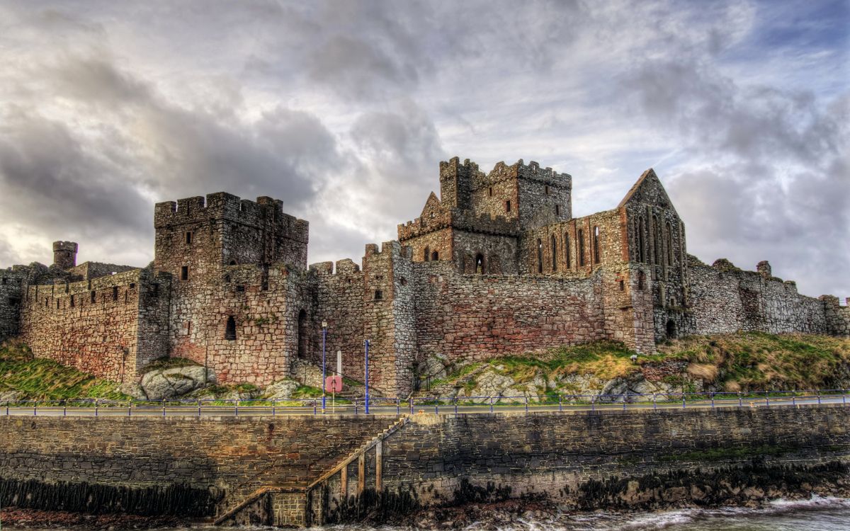 brown concrete castle under cloudy sky during daytime