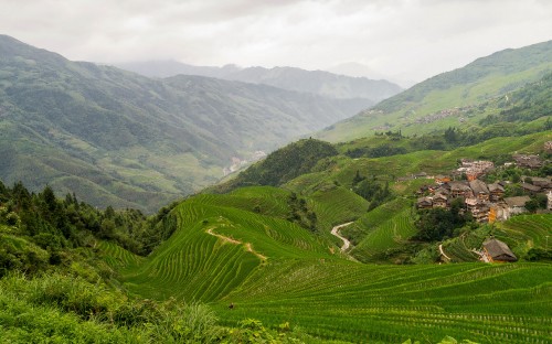 Image green mountains under white sky during daytime