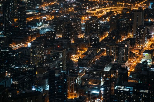 Image aerial view of city buildings during night time