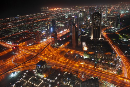 Image city with high rise buildings during night time